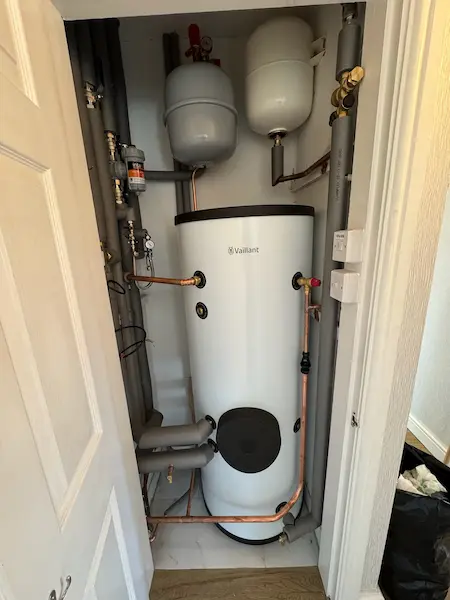 Vector installed a heat pump cylinder in the airing cupboard. Picture shows neat insulated pipework